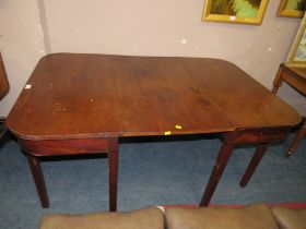 A THREE PIECE MAHOGANY EXTENDING TABLE