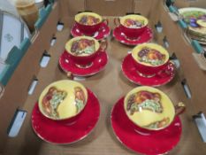A SET OF SIX AYNSLEY ORCHARD GOLD CUPS AND SAUCERS