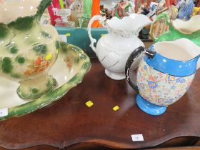 A VICTORIAN TYPE JUG AND BOWL SET TOGETHER WITH THREE LARGE WATER JUGS