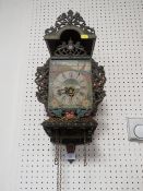 A VINTAGE FRISIAN CHAIR CLOCK WITH TWIN WEIGHTS AND PENDULUM
