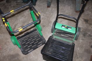 A MODERN PUSH MOWER AND A GARDEN TROLLEY