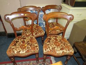 FOUR CARVED MAHOGANY DINING CHAIRS