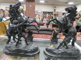 A PAIR OF SPELTER MARLEY HORSES PAINTED BLACK