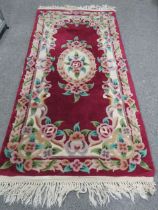 A SMALL CHINESE RUG TOGETHER WITH ORIGINAL TIMES NEWSPAPER FROM JULY 1925 WITH CERTIFICATE OF