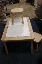 A MODERN IKEA KIDS ACTIVITY TABLE WITH TWO STOOLS