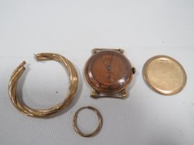 A HALLMARKED 9K GOLD ROTARY WATCH BACK PANEL TOGETHER WITH TWO ODD YELLOW METAL EARRINGS AND A