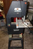 A DEWALT BANDSAW ON STAND