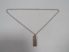 A MENS VINTAGE 1oz SILVER INGOT ON A SILVER CHAIN