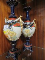 A PAIR OF CONTINENTAL DECORATIVE TWIN HANDLE VASES