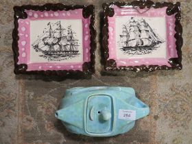 A VINTAGE SADDLER RACING A CAR TEA POT TOGETHER WITH TWO LUSTRE DECORATIVE WALL HANGING SHIPS DESIGN