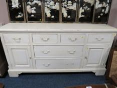 A LARGE WHITE PAINTED PINE DRESSER BASE