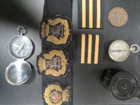 A BAG OF ASSORTED COLLECTABLE'S TO INCLUDE MILITARY CLOTH BADGES, COMPASS ETC