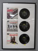 A FRAMED BEATLES 45 SINGLES SET 61 X 40 CM