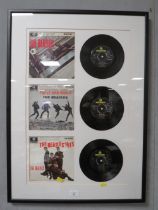 A FRAMED BEATLES 45 SINGLES SET 61 X 40 CM