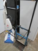 A BISSELL POWER WASH CARPET CLEANER AND A FOLDABLE SACK TRUCK