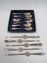 A SET OF SIX HALLMARKED SILVER TEA SPOONS TOGETHER WITH FIVE ASSORTED SILVER PLATED LOBSTER PICKS