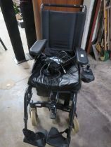 AN INVACARE ELECTRIC WHEELCHAIR
