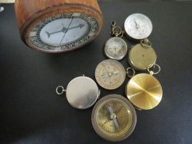 A TRAY OF EIGHT VARIOUS VINTAGE COMPASSES