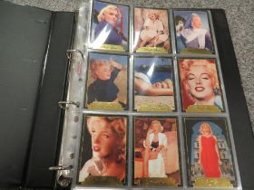 A FOLDER CONTAINING APPROXIMATELY FIFTY-FOUR MARILYN MONROE COLOUR COLLECTORS CARDS