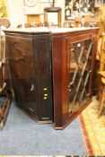 AN ANTIQUE MAHOGANY GLAZED CORNER CABINET TOGETHER WITH AN OAK EXAMPLE (2)