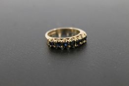 A HALLMARKED 9 CARAT GOLD SAPPHIRE HALF ETERNITY RING approx weight 2.8g