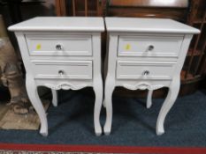A PAIR OF MODERN WHITE TWO DRAWER BEDSIDE CHESTS