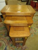 A MODERN OAK NEST OF TABLES