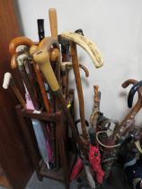 TWO VINTAGE UMBRELLA / STICK STANDS FILLED WITH WALKING STICKS AND UMBRELLAS TO INCLUDE A DISNEY