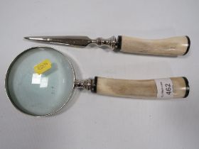 A BONED HANDLE MAGNIFIER GLASS WITH A BONED HANDLED LETTER OPENER