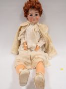 A ANTIQUE PORCELAIN HEADED DOLL WITH MAKERS MARK TO NECK
