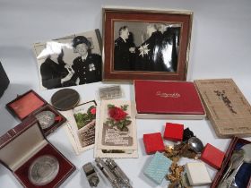 A TRAY OF ASSORTED COLLECTABLE'S TO INCLUDE VINTAGE ENAMEL MEDALS , AMBULANCE ASSOCIATION SILVER FOB