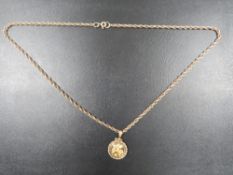 A HALLMARKED 9 CARAT GOLD ROPE TWIST CHAIN WITH PENDANT CONTAINING FLAKES OF GOLD approx weight of