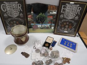 A TRAY OF COLLECTABLE'S TO INCLUDE MEDALLIONS , FRAMED COIN SETS, AND A PAINTED MIRROR