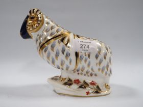 A ROYAL CROWN DERBY PAPER WEIGHT IN THE FORM OF A RAM