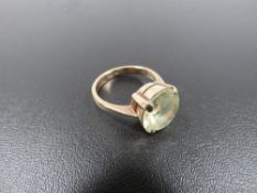 A HALLMARKED 9 CARAT GOLD DRESS RING SET WITH GREEN TOURMALINE STYLE STONE approx weight 4.5g