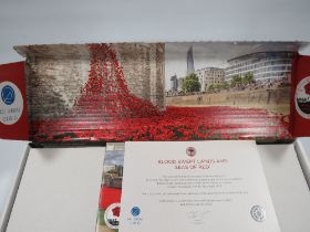 A BOXED PAUL CUMMINS CERAMICS REMEMBRANCE DAY POPPY