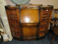 A MID 20TH CENTURY BOW FRONTED BUREAU