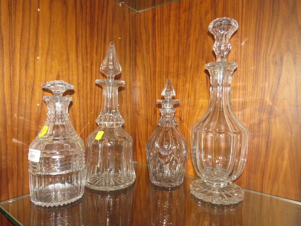 A COLLECTION OF GEORGIAN CUT GLASS DECANTERS