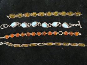 A 926 SILVER AMBER STYLE BRACELET TOGETHER WITH ANOTHER POLISHED BLUE STONE EXAMPLE AND TWO AMBER