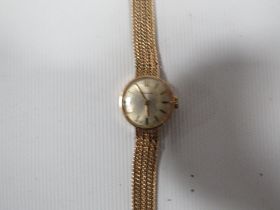 A HALLMARKED 9 CARAT GOLD GARRARD WRIST WATCH A/F