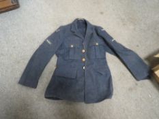 A VINTAGE RAF JACKET WITH SEWN BADGES TO ARMS