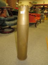 A LARGE VINTAGE SHELL CASING