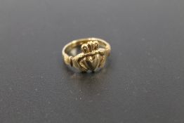 A HALLMARKED 9 CART GOLD CLADDAGH RING approx weight 3.7g