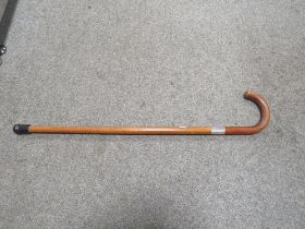 A MALACCA WALKING STICK WITH HALLMARKED SILVER BANDING