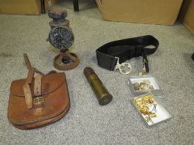 A SELECTION OF MILITARIA TO INCLUDE A VICKERS MACHINE GUN SIEGE LAMP A 1895 BERNDORP GUN SHELL