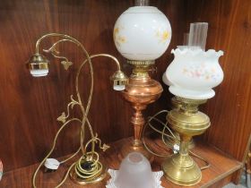 A SELECTION OF CONVERTED OIL LAMPS TOGETHER WITH A TWO BRANCH TABLE LAMP