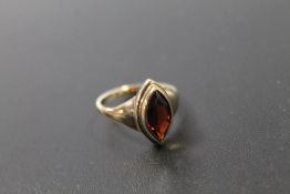 A HALLMARKED 9CT GOLD MARQUISE CUT GARNET RING approx weight 4.3g