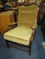 A MID COUNTRY UPHOLSTERED ARMCHAIR