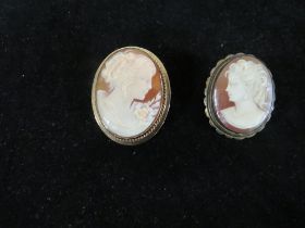 A HALLMARKED 9 CARAT GOLD CAMEO BROOCH TOGETHER WITH A BASE METAL EXAMPLE (2)