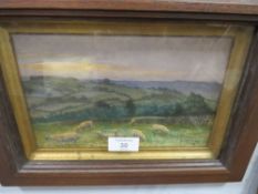 A FRAMED AND GLAZED WATERCOLOUR OF SHEEP GRAZING, HILLS BEYOND, SIGNED AND DATED RUTH CARTLIDGE